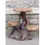 A Chinese hardwood three tier plant stand of rustic form, 64 cm high