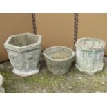 Three reclaimed garden pots of octagonal, hexagonal and circular form, 40 cm diameter and smaller