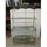 A galvanised iron three tier stand, slatted seat, scrolled supports, 170 cm high x 90 cm wide
