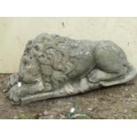 A reconstituted figure of a recumbent lion, 60 cm max