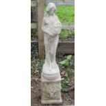 Reclaimed figure of a maiden with flowers set on a square cut base 110 cm in height