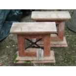 A pair of marble bench ends with iron work x framed centres, 48 cm wide x 43 cm in height (AF)
