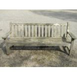 A teakwood garden bench 192 cm wide
