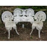 A small aluminium two seat garden bench in a Regency style together with two further aluminium