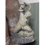 A good quality moulded figure of a young boy wrestling with a snake raised on a classical plinth