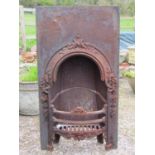 A cast iron Victorian fire insert