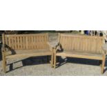 A pair of teakwood garden benches 132 cm wide