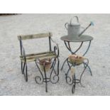 A sprung steel reclaimed garden seat, timber lathes, two ironwork stands with scrolled detail, a