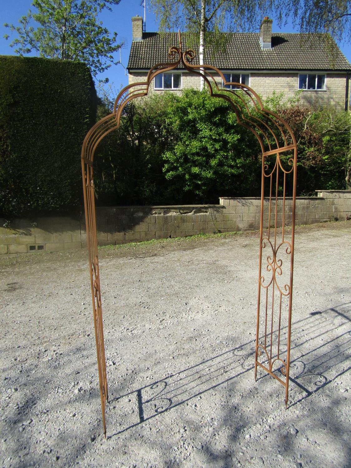 An arched metal arbour/rose arch, 132 cm wide x 230cm high approx