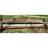 Two galvanised iron field feeding troughs, 270 cm in length and smaller