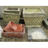 Two reclaimed planters of square cut tapering form, together with a small collection of terracotta