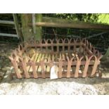 An old English iron log burning basket with fish tail finials, the basket 65 x 40 cm
