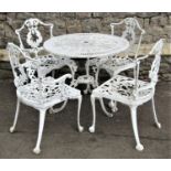 A cast aluminium terrace table, the circular top with pierced detail, together with a set of four