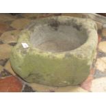 An ancient stone mortar or font, circular with shaped outline, 45 cm diameter