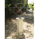 An armillary in bronze raised on a fluted column, 140 cm in height