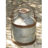 A galvanised iron andiron canister with loop handle complete with cover
