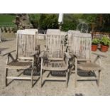 A set of six weathered teak folding garden armchairs by Nova