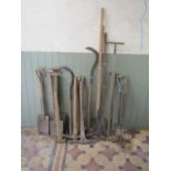 A quantity of good vintage garden tools, mainly with ash handles comprising spade, picks, shovels,
