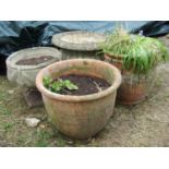 Two reclaimed terracotta garden planters and two further pots of classical design, 50 cm diameter