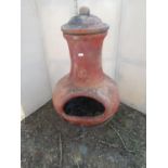 A chimenea on a simple ironwork frame, 82 cm high