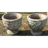 A pair of reclaimed urn shaped garden planters with repeating floral detail, 42 cm diameter