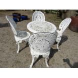A pierced aluminium garden terrace set comprising circular table, 70cm diameter and four chairs