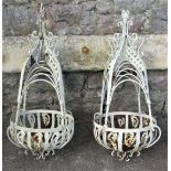 A pair of decorative iron work hanging basket frames with shaped and pierced detail, 65cm approx