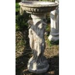 A reclaimed bird bath, the circular top supported by three classical maidens, 80 cm in height