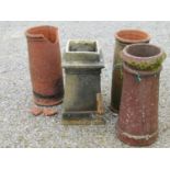 Three terracotta chimney pots and a further buff coloured clay chimney pot, one (AF), 65 cm in
