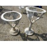A pair of graduated painted aluminium occasional table frames with character and floral detail