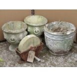 Four reclaimed garden pots together with a small sharpening wheel in an iron work frame