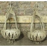 A pair of decorative iron work hanging basket frames with shaped and pierced detail, 1 metre in