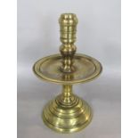 Early Dutch heavy brass candlestick, with turned column and drip tray, 25cm high