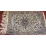 Good quality silk Tabriz prayer mat with scrolled pale blue foliage upon a cream ground, 77 x 51 cm
