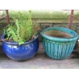 Three contemporary blue green and turquoise glazed planters of varying size and design (one planted)