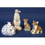 A collection of four Royal Crown Derby paperweights including a meerkat, a recumbent rabbit, a