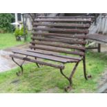 A vintage sprung steel two seat garden bench with weathered timber lathes 122 cm wide