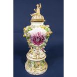 A 19th century continental vase and cover with two finely painted panels in pink of cherubs drinking