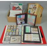 Over 90 packs of British mint issue stamps, an album containing further mint issue stamps, manly