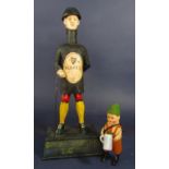A cast iron figural money box for Guinness the base inscribed Good For Him and Good For You since