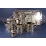 Good quality silver plated four piece tea service of cylindrical tapered form with engraved