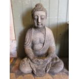 A reclaimed garden ornament in the form of a seated buddha 70 cm high approx