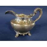 William IV Scottish silver squat baluster sauce/cream jug, with cast floral rim and C scroll handle,