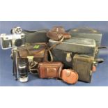 A large collection of mixed vintage cameras and accessories to include lenses, a projector,