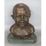 E Whitney-Smith bronze bust of a child, signed and dated 1915, upon a green veined marble base, 32cm