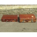 A vintage Revelation tan coloured vulcanized fibre suitcase with stitched leather handle and metal
