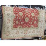 Turkish Caucasian carpet with typical pastel red and green colours with geometric floral pattern,