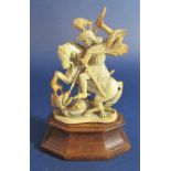 19th century probably Dieppe ivory carved stained ivory figure of St George slaying the dragon, upon