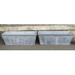 A pair of Heritage galvanised tin planters of rectangular tapered form 105cm long x 35cm wide x 36cm