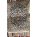 A good quality small silk Tabriz rug/prayer mat, with scrolled foliage upon a pale blue ground,
